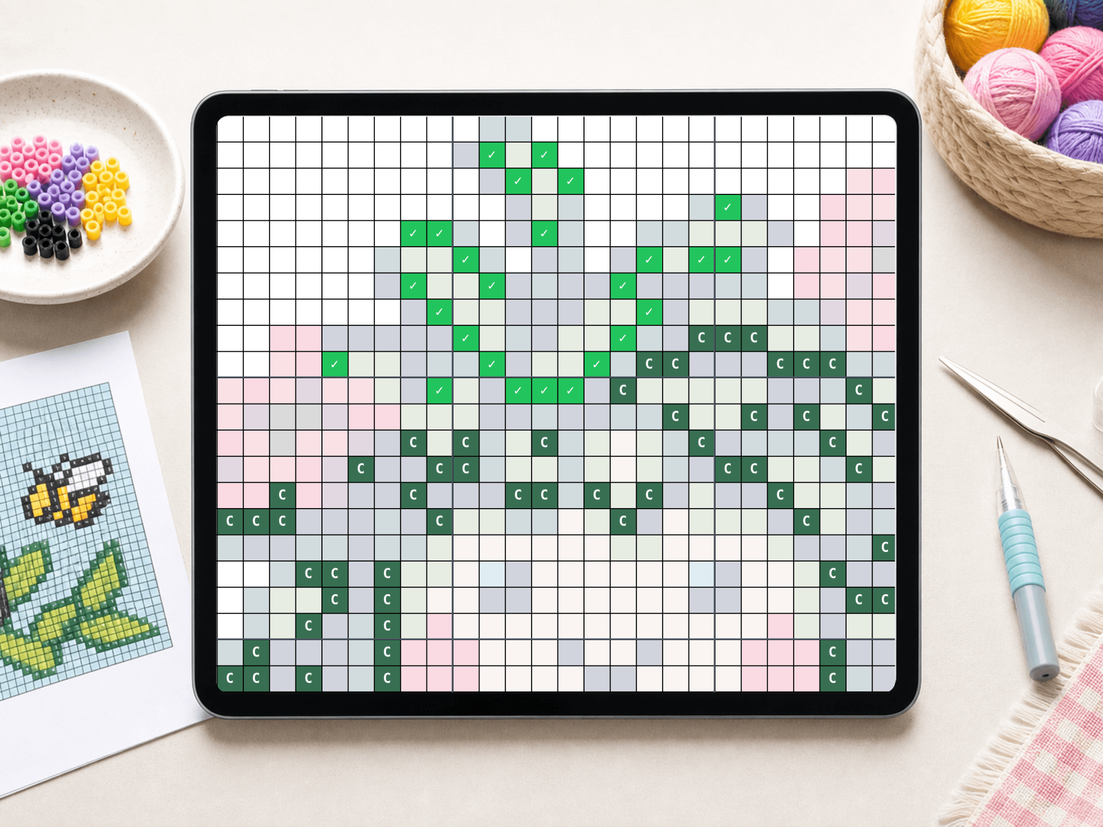 Pixel Peeper grid with finished cells marked on a tablet